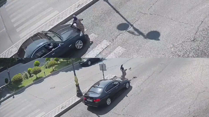 Qırmızı işıqda yola qaçan qadını avtomobil vurub - VİDEO