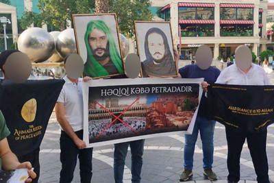 “28 Mall”un qarşısında plakat açan təriqət üzvləri həbs edildi