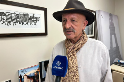 Reza Deqati Parisdə etiraz aksiyalarını işıqlandırarkən xəsarət alıb